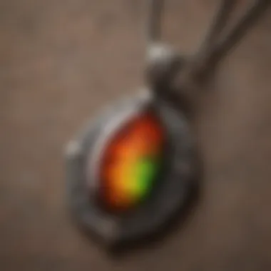 A beautifully crafted ammolite pendant displayed elegantly on a soft fabric background.