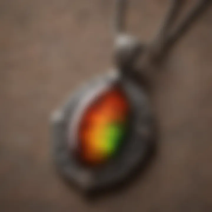 A beautifully crafted ammolite pendant displayed elegantly on a soft fabric background.