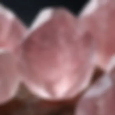 A detailed close-up of rose quartz, displaying its translucent pink color and smooth surface.