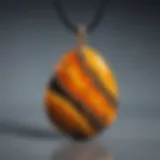 A close-up view of a bumblebee jasper pendant showcasing its vibrant yellow and black patterns.