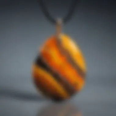 A close-up view of a bumblebee jasper pendant showcasing its vibrant yellow and black patterns.