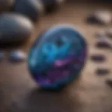 Close-up view of a polished covellite cabochon showcasing its unique blue and purple hues