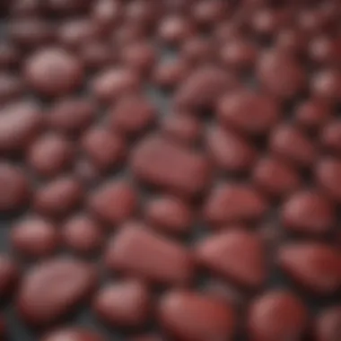 Elegant Display of Polished Dark Red Stones Collection of polished dark red stones displayed elegantly.