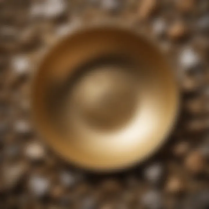 A close-up of a gold pan filled with gravel and a hint of shiny gold flecks.