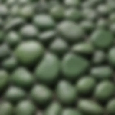 An artistically arranged set of green translucent stones against a natural background.