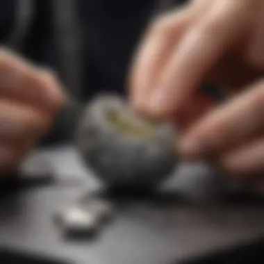 An artisan at work, carefully crafting a piece of silver pickle jewellery with precision and skill.