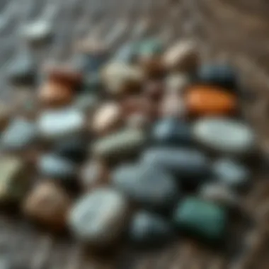 Diverse Selection of Worry Stones A collection of various worry stones displayed on a textured surface