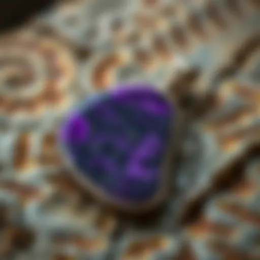 Close-up view of a charoite pendant showcasing its unique purple patterns