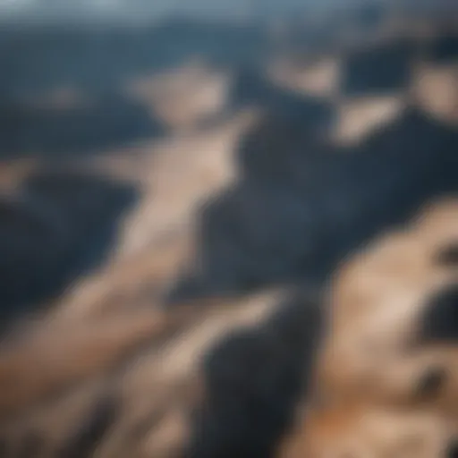 Aerial view of an expansive granite mountain range showcasing intricate geological patterns