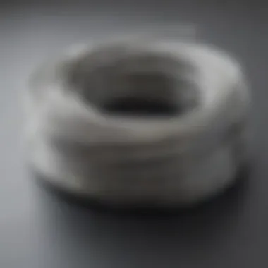 A coil of dead soft silver wire elegantly displayed on a workspace