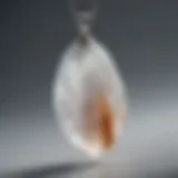 A close-up view of a selenite crystal pendant showcasing its translucent beauty and unique striations