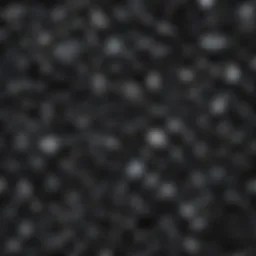 A collection of various black gemstones showcasing their unique textures and shine.