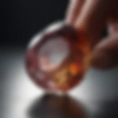 A close-up view of a gemstone being examined under natural light, revealing its intricate details.