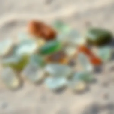Artistic Display of Sea Glass Variations An artistic arrangement of different sea glass gemstones, highlighting their unique shapes and textures against a sandy backdrop.