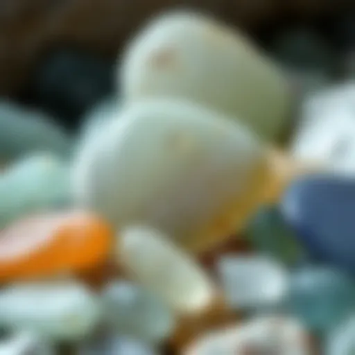 A close-up photograph of beautifully polished sea glass pieces in various colors, showcasing their natural beauty.